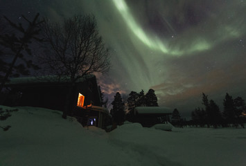 Night shot of northern lights in frozen winter country