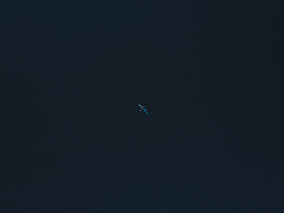Fototapeta premium Aerial shot of kayak on lake and sunset