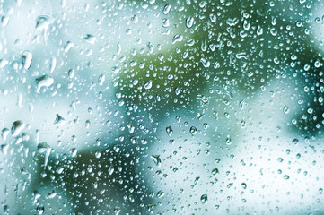 Rain drops on the window glass, water on mirror, selective focus