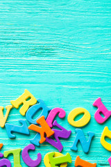 Multiple colored letters on wooden table