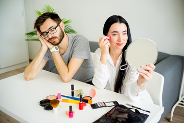 Bored husband waiting for wife