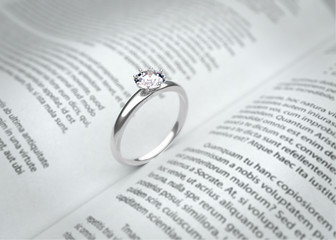 Wedding ring on the book page. 3D illustration