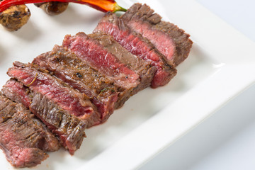 Juicy steak medium rare beef with spices and grilled vegetables