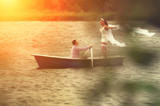 Couple in a boat outdoors - Powered by Adobe