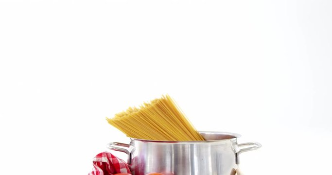 Raw spaghetti with cherry tomatoes and garlic
