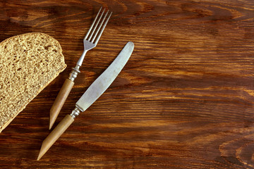A piece of rye bread and cutlery