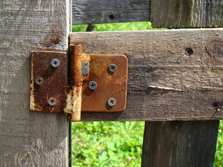 Old hinge on the door close up