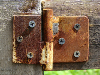 Old hinge on the door close up