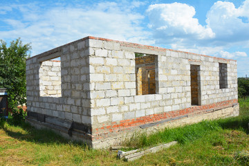 Fototapeta na wymiar Building House from Autoclaved Aerated Concrete Blocks with concrete lintel and Unfinished Roof.