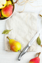 Pears, knife, plate and place for text.