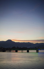 Fototapeta premium view of old bridge in kampot town cambodia at sunset