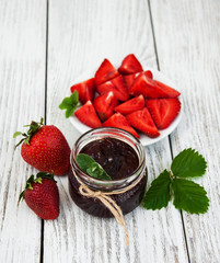 Strawberry jam and fresh strawberries