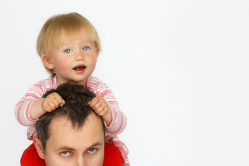 Fototapeta na wymiar Baby sitting on father neck on white background