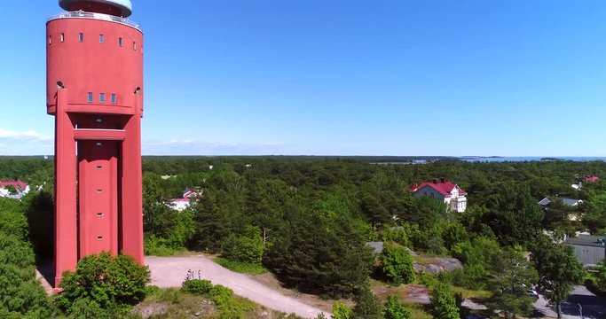 Watertower, Cinema 4k aerial rising view of Hanko water tower, on Hango regatta day, in Uusimaa, Finland