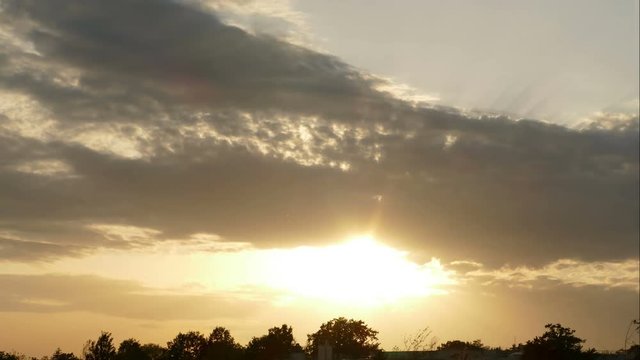 4K time lapse of Sunset with rays at small Dutch village
