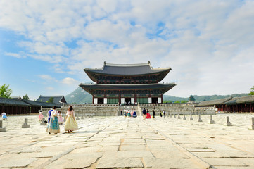 Tourists wearing traditional Korean clothes Hanbok at the Gyeongbokgung Palace in Seoul City, South Korea.