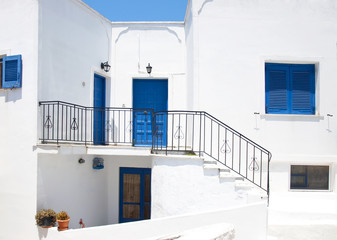 Traditional greek architecture with blue doors in the city of Pyrgos on the island of Santorini, Greece, Europe.