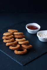 Onion rings with mayonnaise and ketchup