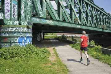 Railway bridge with graffiti at Bromley by Bow in east London. UK