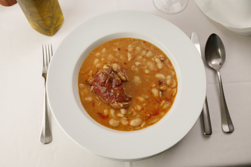 Bean soup arranged in a plate, Traditional dish in elegant setting, Selective focus with soft light