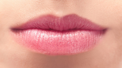 Young woman with natural lips makeup, closeup