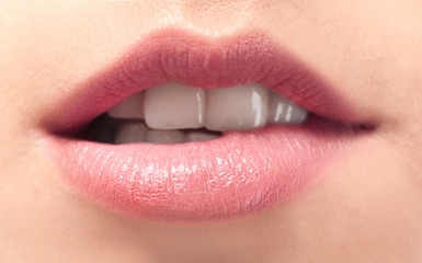 Fototapeta premium Young woman with natural lips makeup, closeup