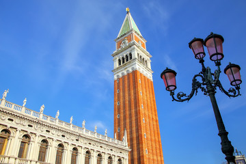 Fototapeta na wymiar Close view of St Mark's Campanile and Biblioteca at Piazzetta San Marco in Venice, Italy