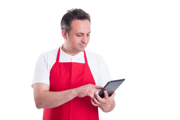 Young store supervisor with tablet pc in hand