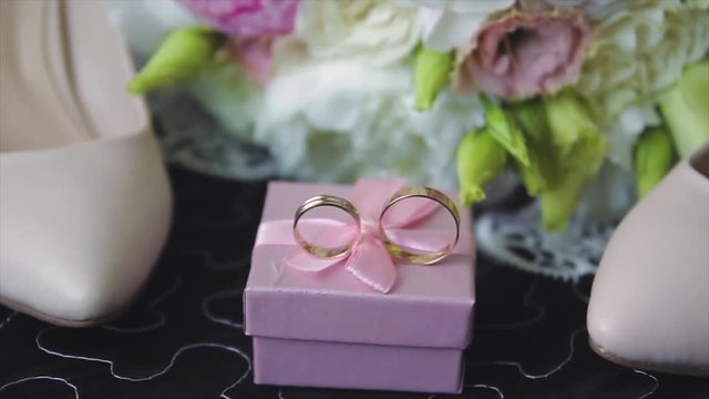 Rings newlyweds and a bride bouquet with accessories