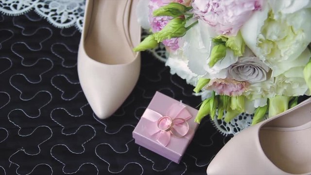 Rings newlyweds and a bride bouquet with accessories