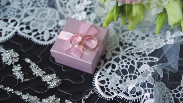 Rings newlyweds and a bride bouquet with accessories