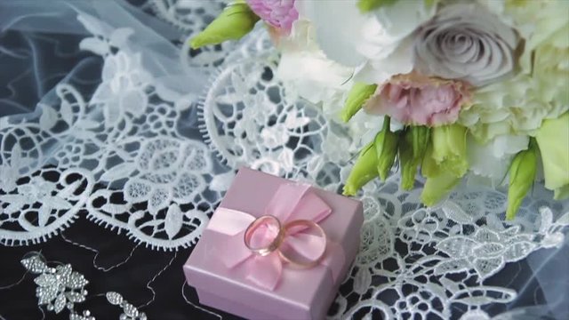 Rings newlyweds and a bride bouquet with accessories