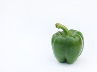 Green bell pepper isolated on white background.