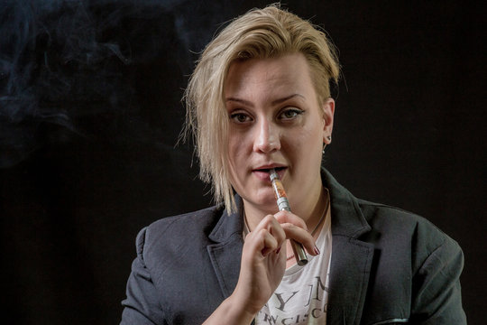 Female smoking vaporizer and thinking