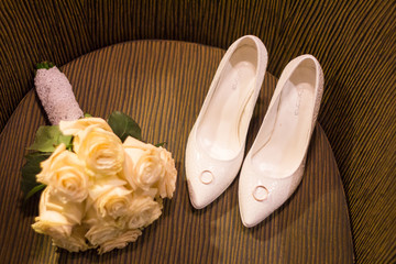 wedding rings shoes and flowers