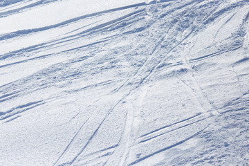 Traces of skis on snow as background