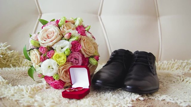 Rings newlyweds and a bride bouquet with accessories