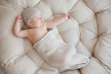 Cute little baby sleeping on lounge at home © Africa Studio