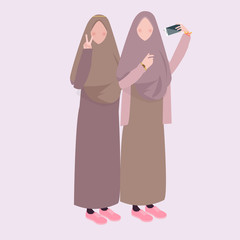 two girl take selfie together friends wearing veil head scarf