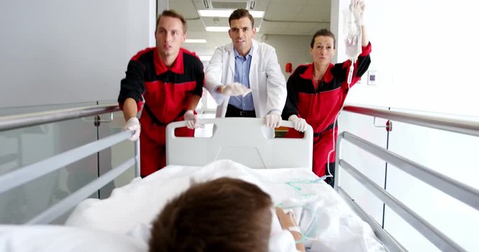 Doctor and paramedics rushing a patient in emergency