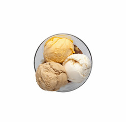 ice cream in balls in glass glass on white background. top view