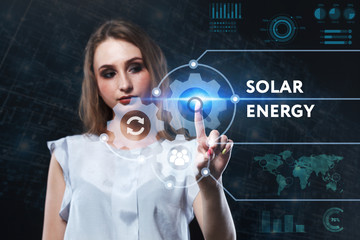 The concept of business, technology, the Internet and the network. A young entrepreneur working on a virtual screen of the future and sees the inscription: Solar energy