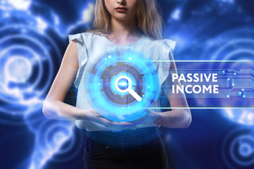 The concept of business, technology, the Internet and the network. A young entrepreneur working on a virtual screen of the future and sees the inscription: Passive income