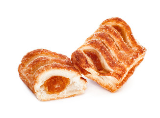 Delicious sweet puff pastry with fruit jam on white background