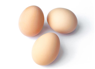 Raw brown eggs isolated on white