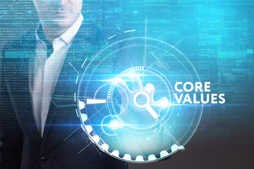 Business, Technology, Internet and network concept. Young businessman working on a virtual screen of the future and sees the inscription: Core values