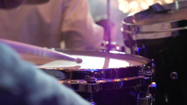 Drummer playing on stage close-up Slow motion 