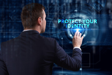 Business, Technology, Internet and network concept. Young businessman working on a virtual screen of the future and sees the inscription: Protect your identity