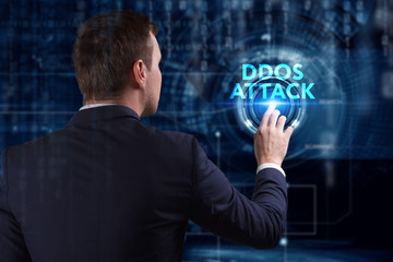 Business, Technology, Internet and network concept. Young businessman working on a virtual screen of the future and sees the inscription: Ddos attack