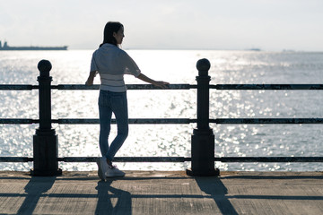 Woman and sunset at seaside